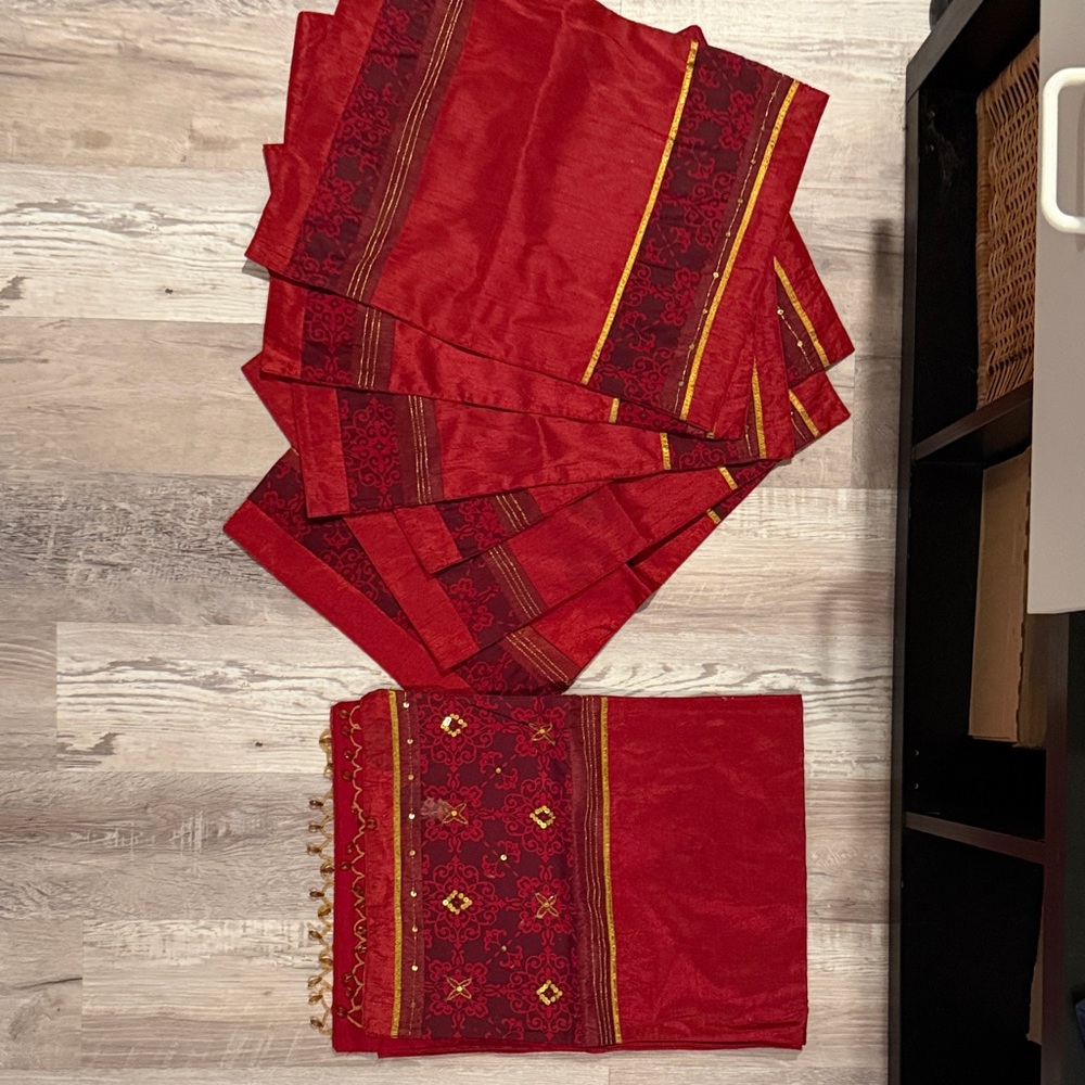 6 red placemats and 1 matching table runner from Pier 1